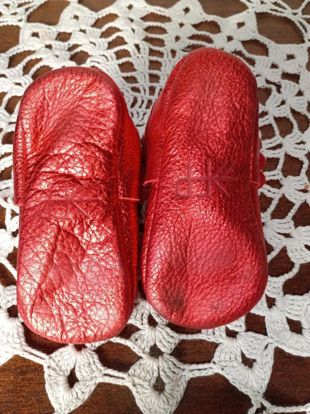 Freshly picked ruby red baby mocassins with bow and ruffles size 5